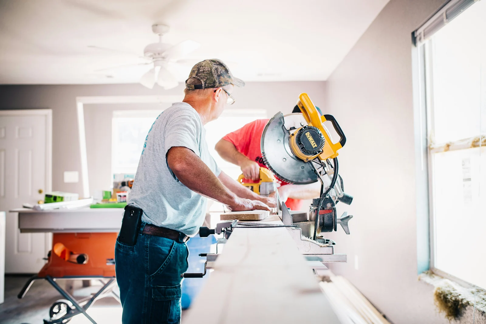 Contractor working with a miter saw during a home renovation