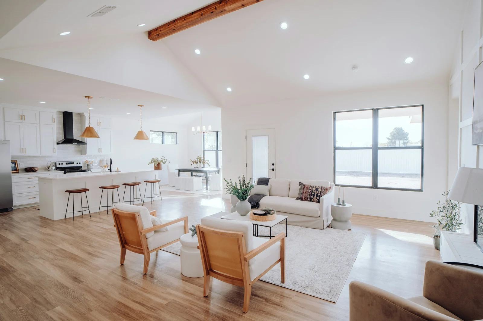Bright renovated open-plan living room with vaulted ceiling