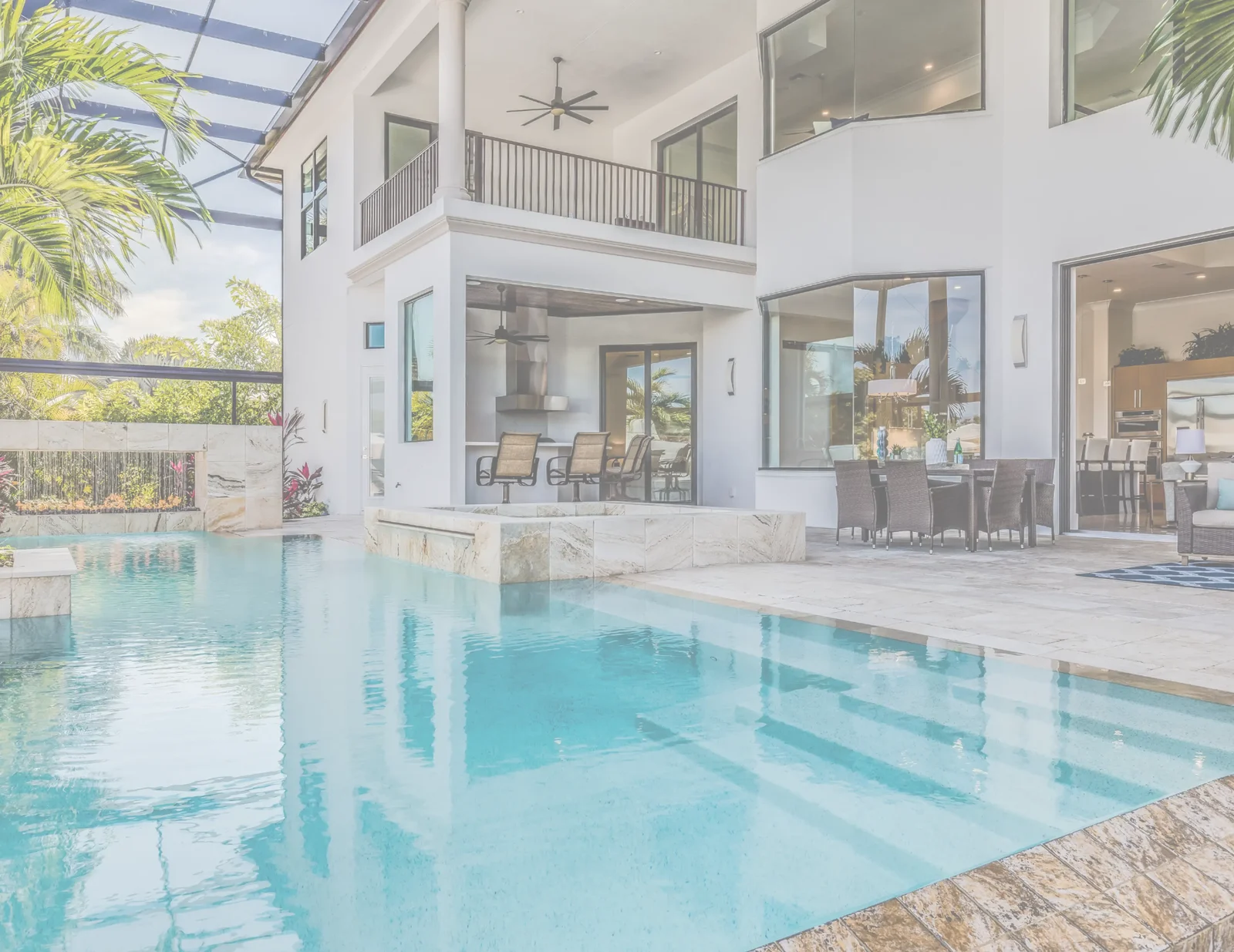 Screened pool and outdoor living area of a well-maintained vacation home, ready for guests